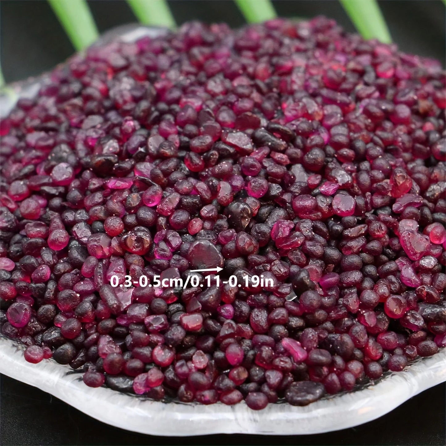 Small granular garnet gravel for decorating fish tanks.