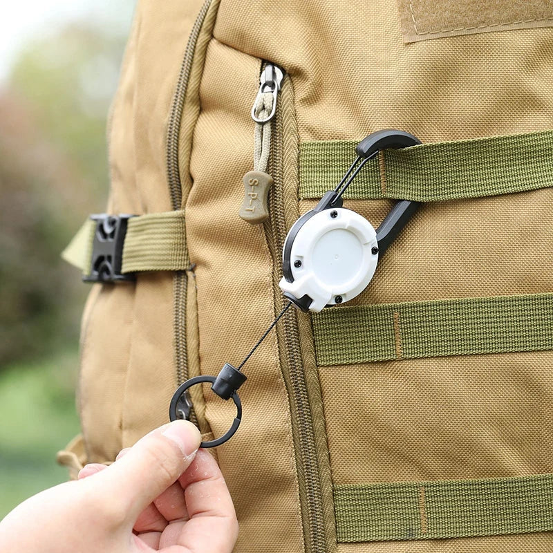 Outdoor automatic retractable keychain with anti-theft wire rope for backpacks. This anti-loss keychain features a spring and is great for camping gear.